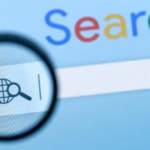 Google search bar with magnifying glass representing Google Flights flight search tool