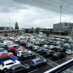 Manchester Airport car park with parked cars near terminal