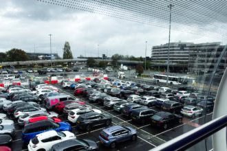 Manchester Airport car park with parked cars near terminal