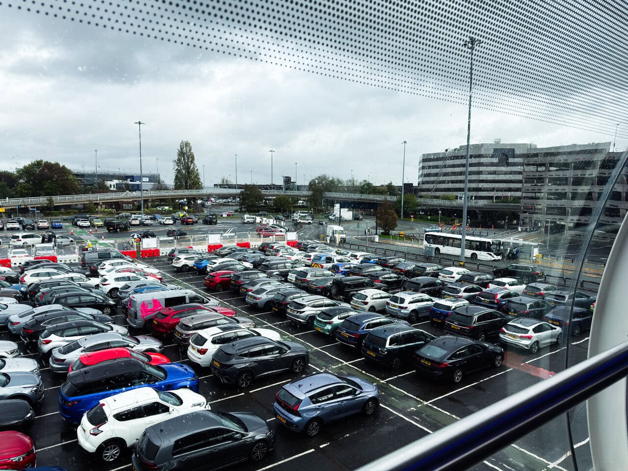 Manchester Airport car park with parked cars near terminal