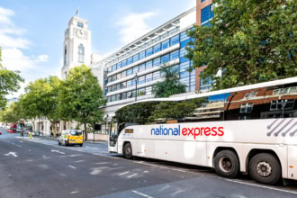 National Express coach parked on a London street near Victoria Coach Station used for long-distance bus routes across the UK
