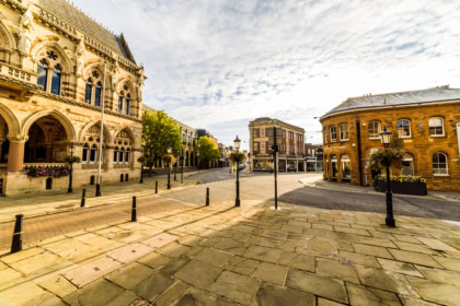 Historic market square and town centre buildings in Northamptonshire England