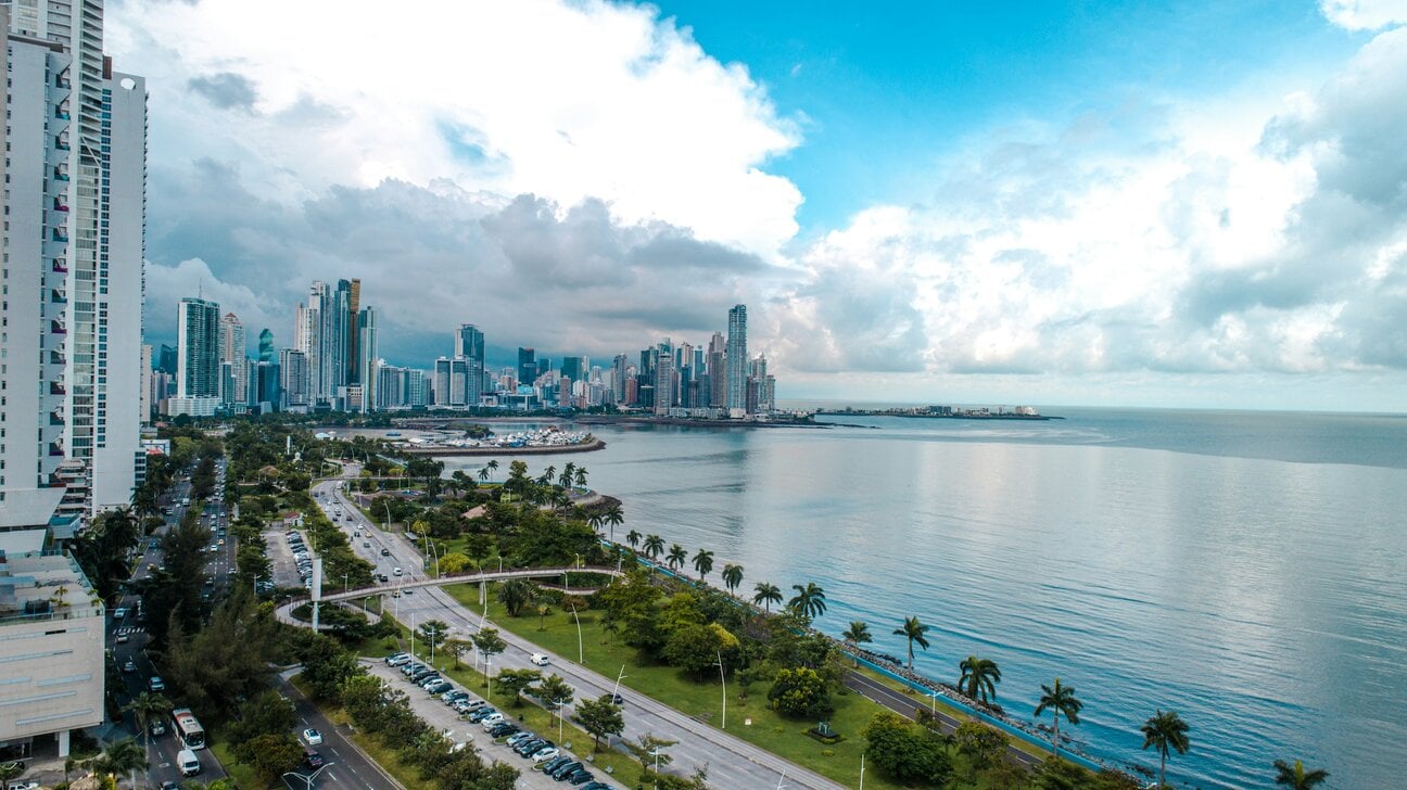 Panama City skyline along the coast with modern skyscrapers and waterfront road