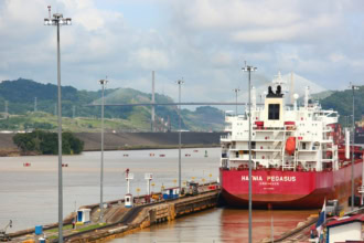 Cargo ship passing through Panama Canal locks near Panama City