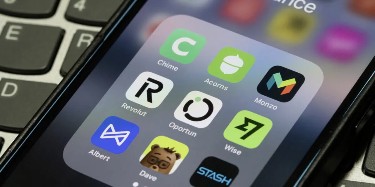 finance apps on smartphone including Revolut and Wise for earning travel rewards points