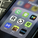 finance apps on smartphone including Revolut and Wise for earning travel rewards points