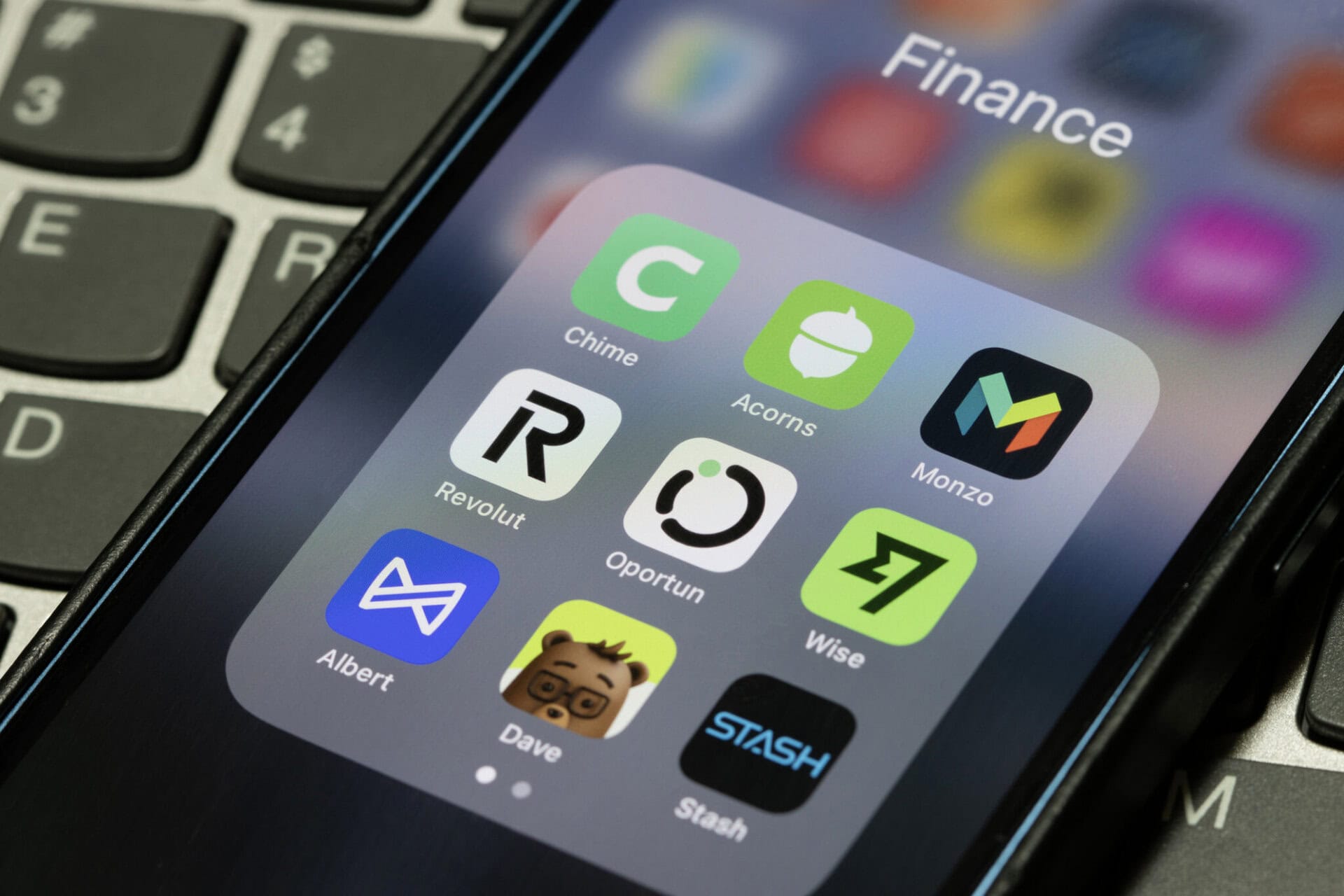 finance apps on smartphone including Revolut and Wise for earning travel rewards points