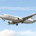 Royal Air Maroc Boeing 737 aircraft flying in clear blue sky
