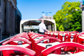 Upper deck seats on a hop-on hop-off sightseeing bus during a city tour