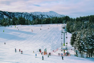 Skiing in Andorra Pyrenees ski resort slopes and chairlift