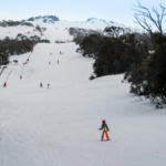 Skiers on a slope at Thredbo ski resort Australia
