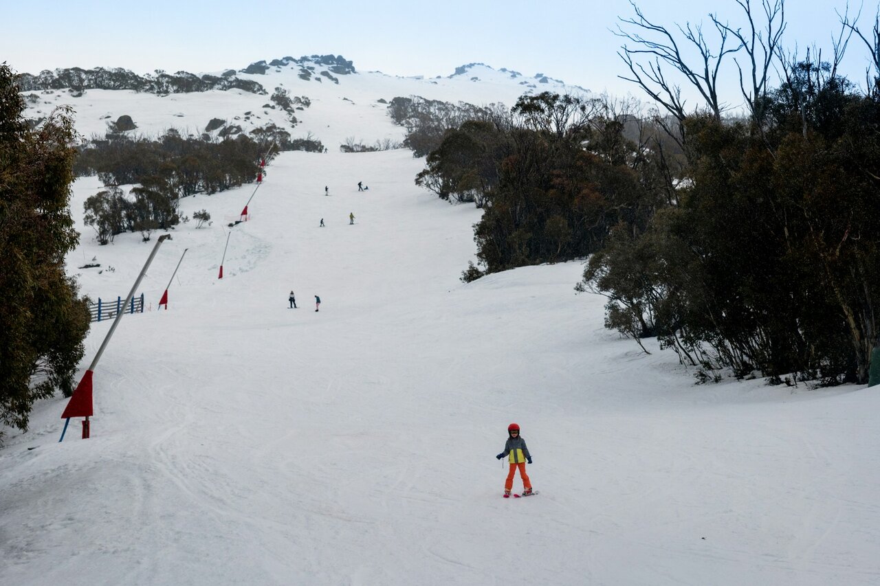 Skiers on a slope at Thredbo ski resort Australia