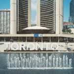 Toronto sign at Nathan Phillips Square and Toronto City Hall