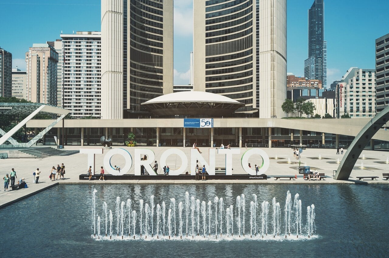 Toronto sign at Nathan Phillips Square and Toronto City Hall