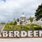 Aberdeen city sign with Marischal College in the background, Scotland travel guide