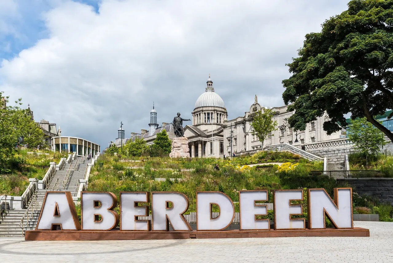 Aberdeen city sign with Marischal College in the background, Scotland travel guide