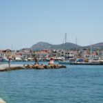Aegina harbour waterfront Greece fishing boats and chapel
