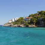 Agistri coastline turquoise water pine trees Saronic Gulf Greece