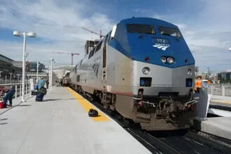 Amtrak long distance sleeper train at a station platform in the United States