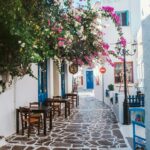 traditional Greek island street with bougainvillea in Milos