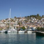 Poros harbour Greece with boats and hillside town