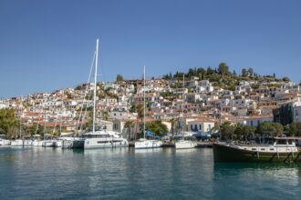 Poros harbour Greece with boats and hillside town