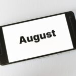 Best places to visit in August shown on smartphone screen