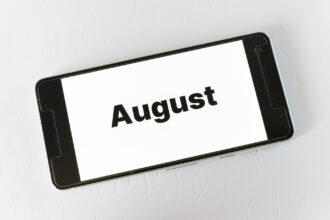 Best places to visit in August shown on smartphone screen
