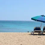 Barbados beach with sun loungers and umbrella on the south coast