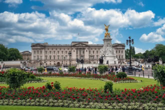 Buckingham Palace in London with the Victoria Memorial and gardens in front