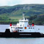 CalMac ferry sailing between Scottish islands in the Hebrides