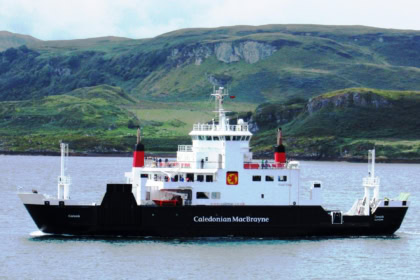 CalMac ferry sailing between Scottish islands in the Hebrides