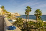 Ceuta coastline and city skyline with church and Mediterranean beach