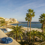 Ceuta coastline and city skyline with church and Mediterranean beach