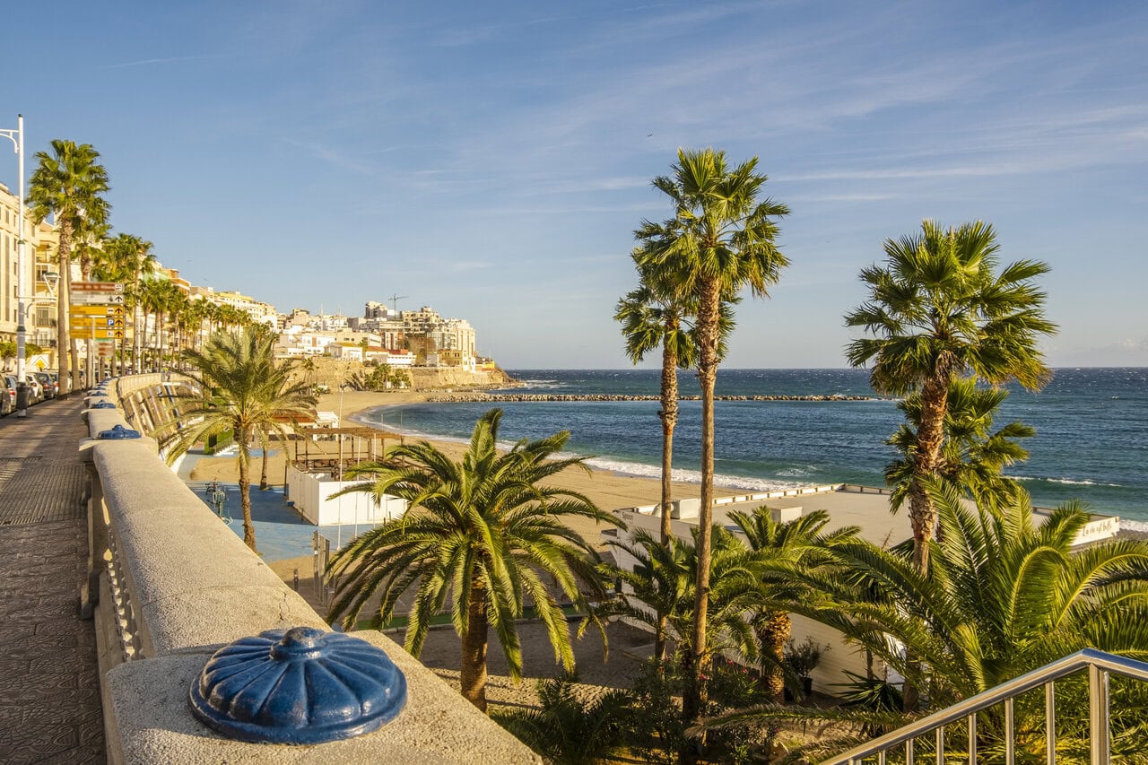 Ceuta coastline and city skyline with church and Mediterranean beach