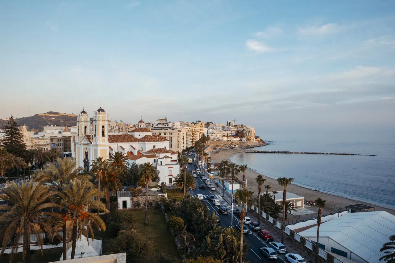 Ceuta promenade with palm trees and Mediterranean beach