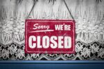 Closed sign representing travel company closure and holiday refund rights Caption: A closed sign representing travel companies going out of business and holida