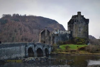 Dunvegan Castle on the Isle of Skye Scotland with stone bridge