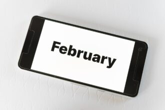 February travel planning on smartphone screen showing February calendar