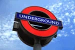 London Underground sign symbol on blue sky background
