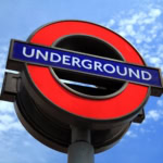 London Underground sign symbol on blue sky background