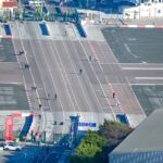 Pedestrians crossing Gibraltar airport runway border