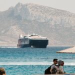 high-speed Greek ferry crossing Aegean Sea with mountains in background