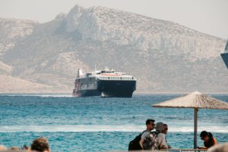 high-speed Greek ferry crossing Aegean Sea with mountains in background