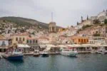 Hydra harbour clock tower and waterfront Saronic Islands Greece