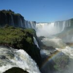 Iguazu Falls waterfalls on the Argentina Brazil border with rainbow and river