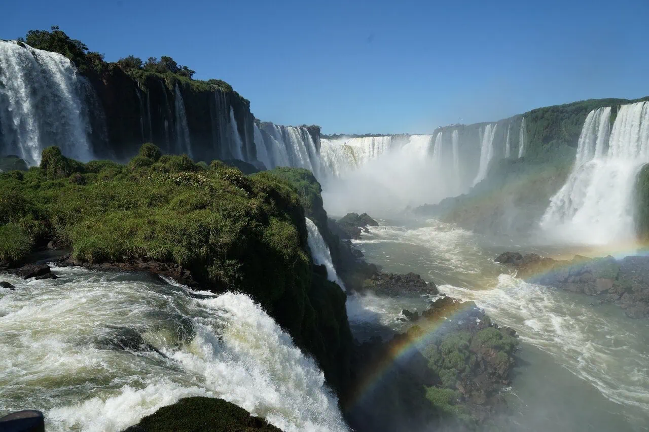 Iguazu Falls waterfalls on the Argentina Brazil border with rainbow and river