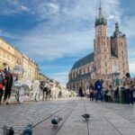 Kraków Main Market Square with St Mary's Basilica and horse carriages