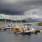 Kyle of Lochalsh harbour with boats and the Skye Bridge in the Scottish Highlands