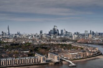 London skyline showing the City of London and Canary Wharf near major London airports